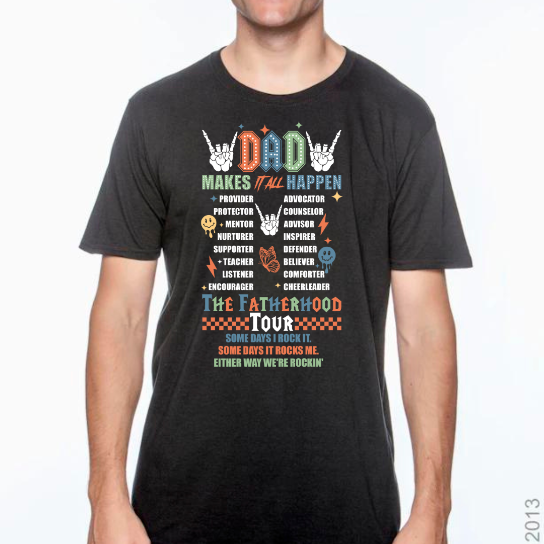 Image of a T-shirt with ‘Dads Make It All Happen’ emblazoned across the top in bold, stylish lettering. Below, the shirt lists roles like Coach, Protector, Teacher, and Hero, as part of a ‘Fatherhood Tour’ motif, symbolizing the diverse roles dads play. The T-shirt is available in three colors: black, yellow, and gray, displayed side by side to show variety. Ideal for celebrating the everyday heroes that are dads.