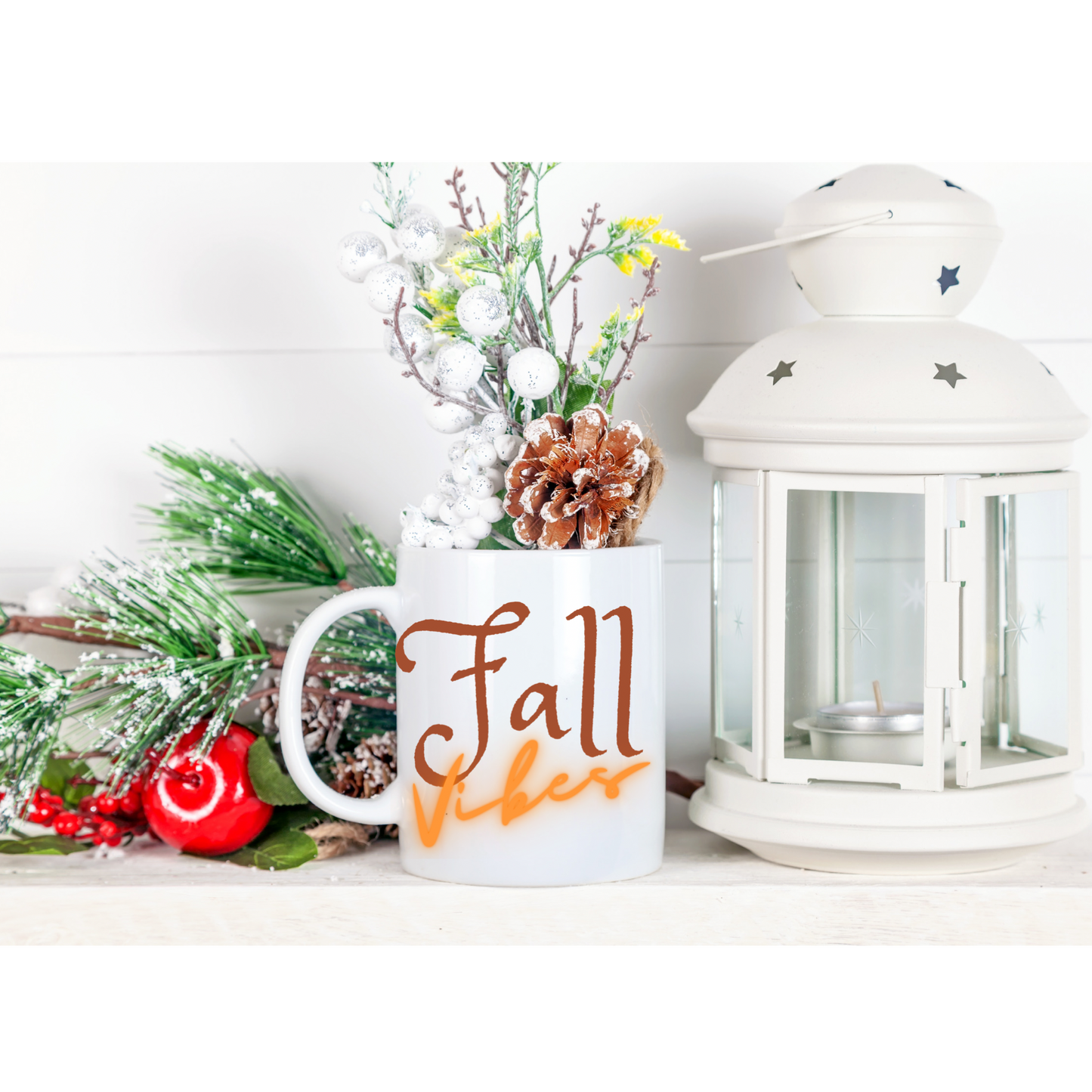 An 11 oz ceramic mug with a “Fall Vibes” design, featuring retro-inspired autumn colors. The mug is filled with a hot beverage and surrounded by fall-themed decor, emphasizing its cozy and seasonal appeal.