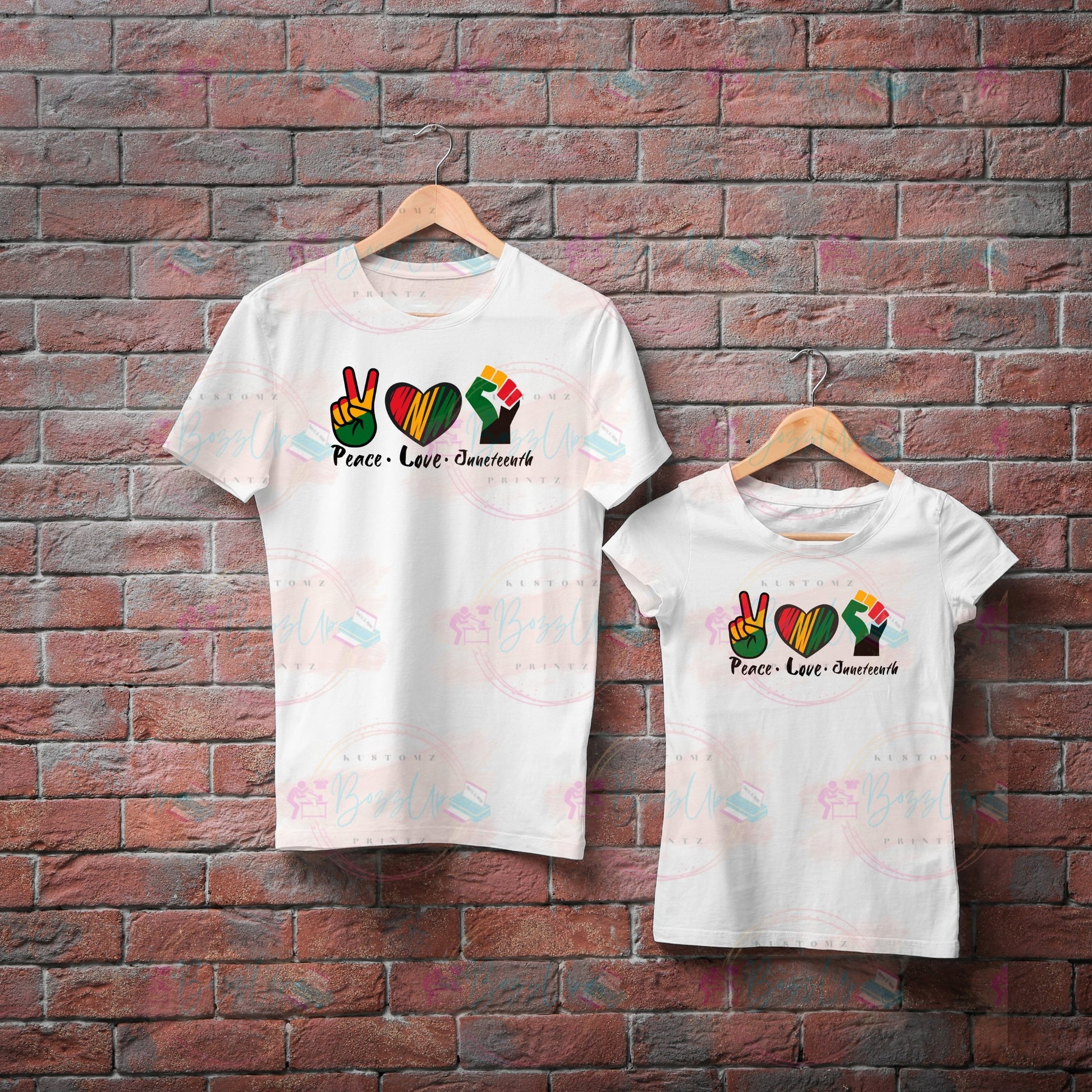 A t-shirt featuring the words “peace,” “love,” and “Juneteenth” in vibrant red, yellow, black, and green colors representing African American culture. Each word is enhanced with a symbolic icon: a peace sign over “peace,” a heart over “love,” and an empowerment fist over “Juneteenth.” This design celebrates cultural pride and unity, ideal for Juneteenth commemorations and everyday wear for infants, kids and adults. Bozzup Kustomz